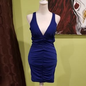 Ruched Form Fitting Mini Dress With Sexy Back
